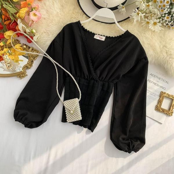 Καθημερινή  γυναικεία μπλούζα με μακρύ μανίκι σε μαύρο και άσπρο χρώμα