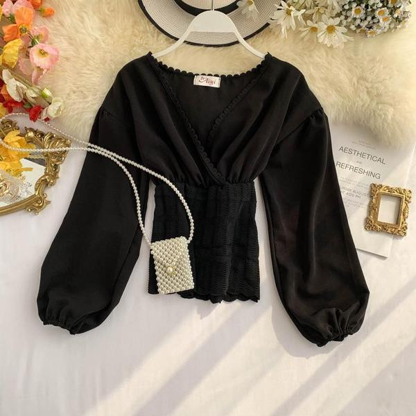 Καθημερινή  γυναικεία μπλούζα με μακρύ μανίκι σε μαύρο και άσπρο χρώμα