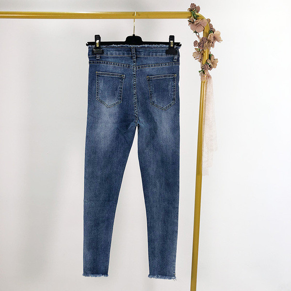 Női farmer karcsú modell szakadt motívumokkal, két színben