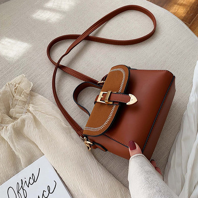 Μοντέρνα γυναικεία τσάντα με πόρπη σε διάφορα χρώματα