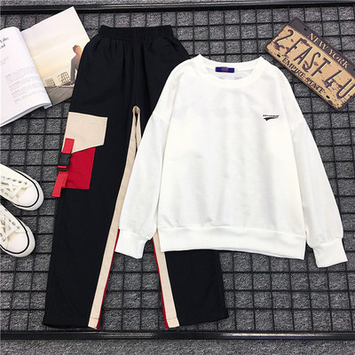 Set sport dama - bluza alba si pantaloni cu buzunar negru