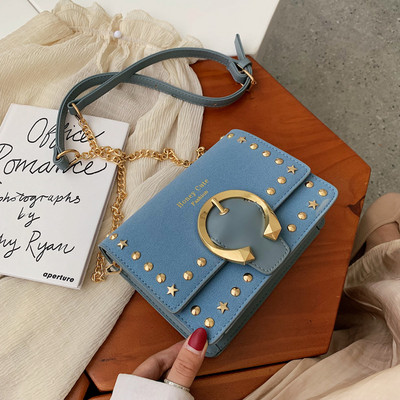 Μοντέρνα γυναικεία τσάντα με μεταλλική διακόσμηση σε διάφορα χρώματα