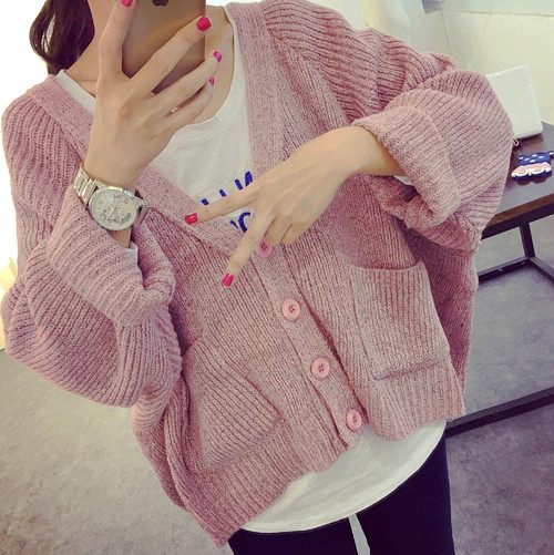 Női mellény gombokkal és zsebekkel - széles modell