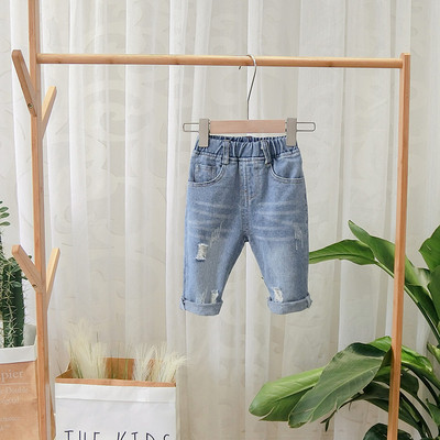 Aktuális gyerekfarmer szakadt motívumokkal fiúknak kék színben