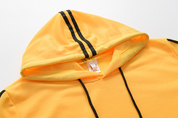 Спортен дамски комплект с кантове в жълт цвят