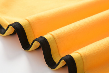 Спортен дамски комплект с кантове в жълт цвят