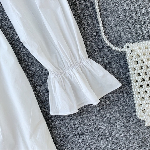 Γυναικείο φόρεμα με μακριά μανίκια και κουμπιά σε μαύρο και άσπρο χρώμα