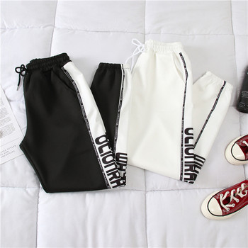 Дамски панталон в черен и бял цвят с надпис