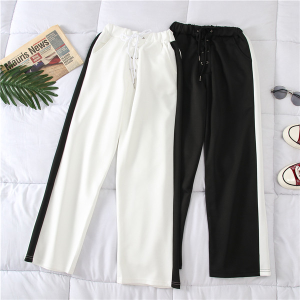 Alkalmi női nadrág fehér és fekete színben, szegéllyel