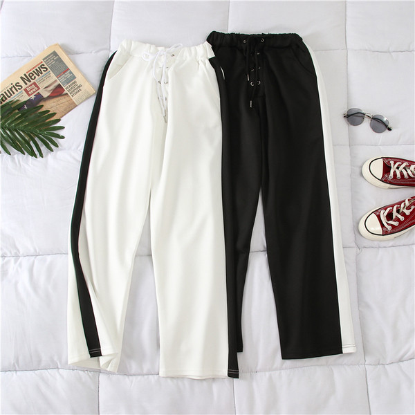 Alkalmi női nadrág fehér és fekete színben, szegéllyel