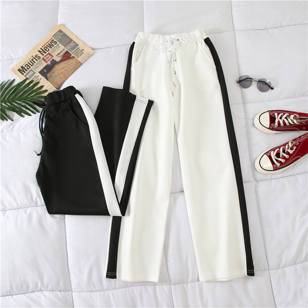 Alkalmi női nadrág fehér és fekete színben, szegéllyel