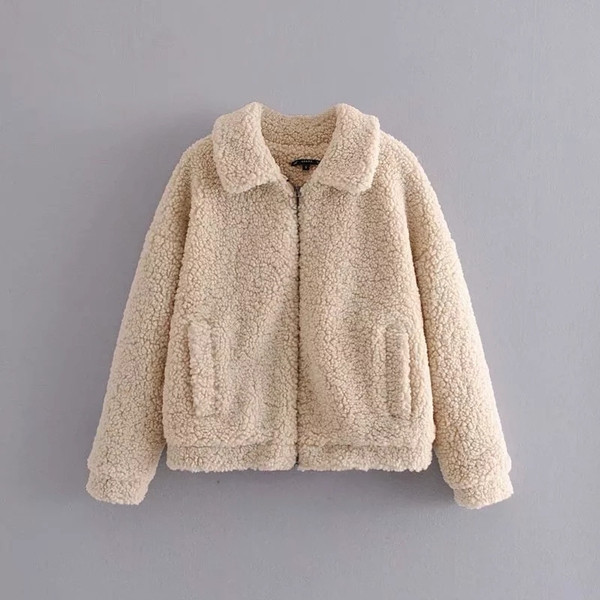 Aktuális pehely női kabát bézs színű zsebekkel