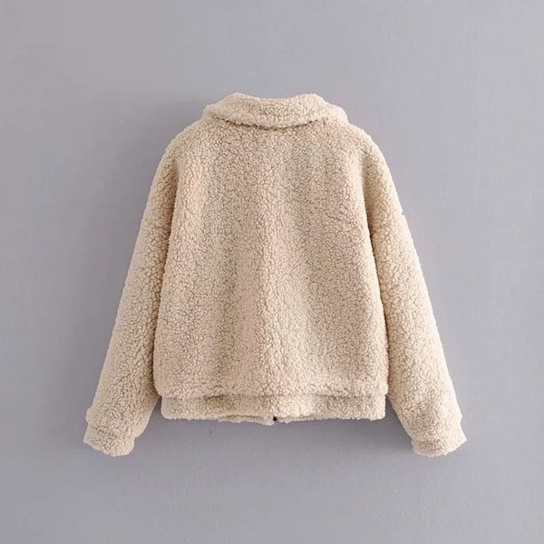 Aktuális pehely női kabát bézs színű zsebekkel