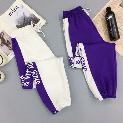 Women`s sports pants with inscriptions - in two colors
