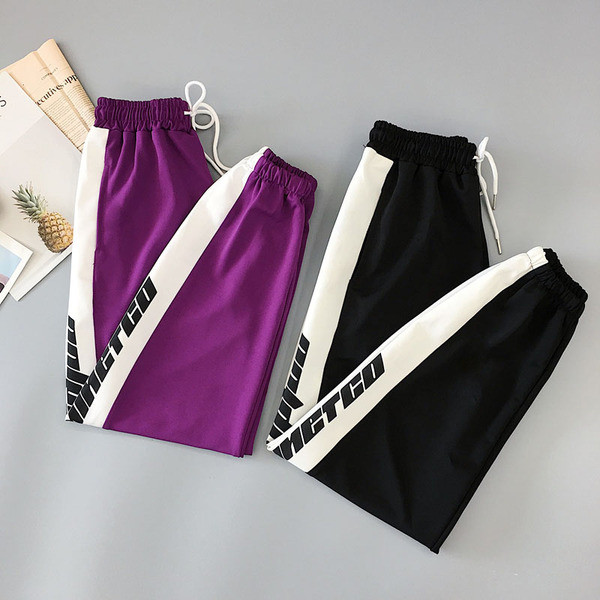 Női nadrág két színben felirattal és nyakkendővel