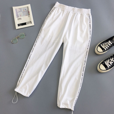 Γυναικεία παντελόνια σε λευκό και μαύρο χρώμα  με  κορδόνια  και επιγραφές