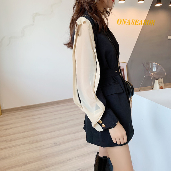 Modern női hosszú kabát fekete övvel