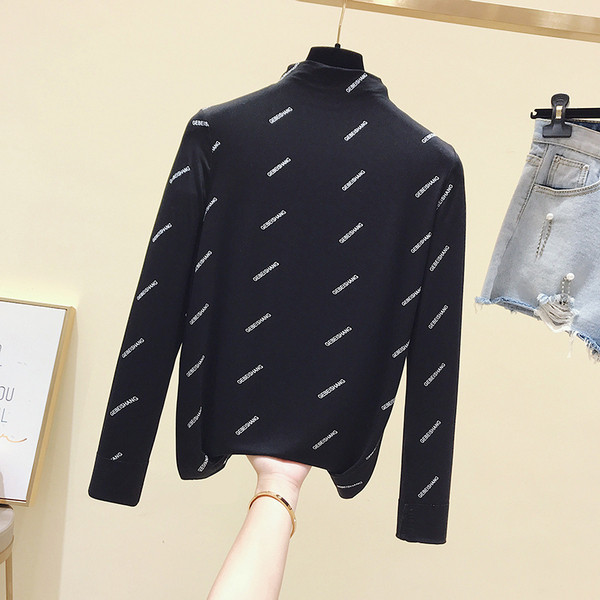 Καθημερινή  γυναικεία μπλούζα με μακριά μανίκια σε λευκό και μαύρο χρώμα