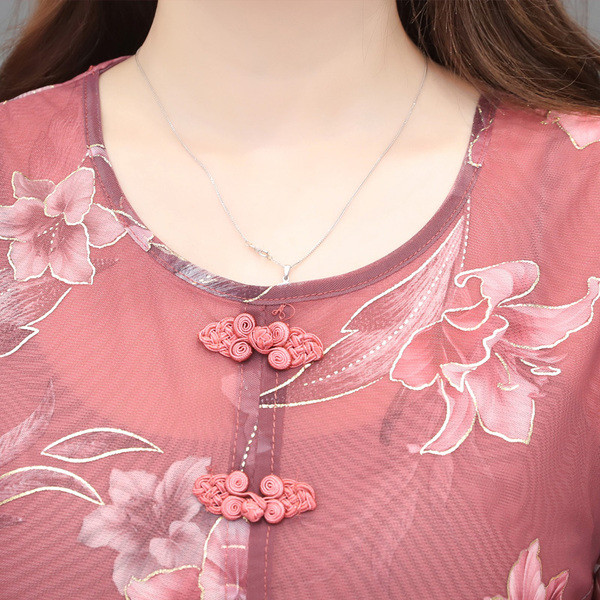 Μοντέρνα γυναικεία μπλούζα σε κόκκινο και μπλε χρώμα με μοτίβα λουλουδιών