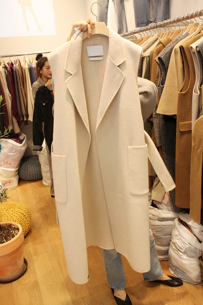Актуален дамски зимен елек с джобове -дълъг модел в два цвята 