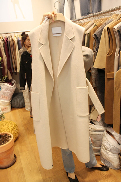 Актуален дамски зимен елек с джобове -дълъг модел в два цвята 