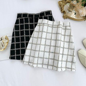 Модерна дамска пола в бял и черен цвят с висока талия и цип