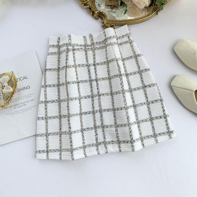 Модерна дамска пола в бял и черен цвят с висока талия и цип