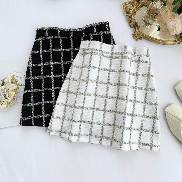 Модерна дамска пола в бял и черен цвят с висока талия и цип