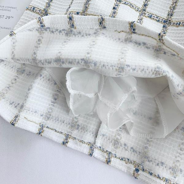 Модерна дамска пола в бял и черен цвят с висока талия и цип