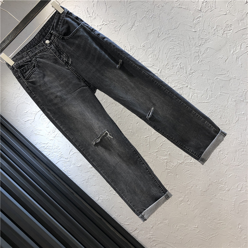 Női hosszú farmer, fekete színben, szakadt motívummal