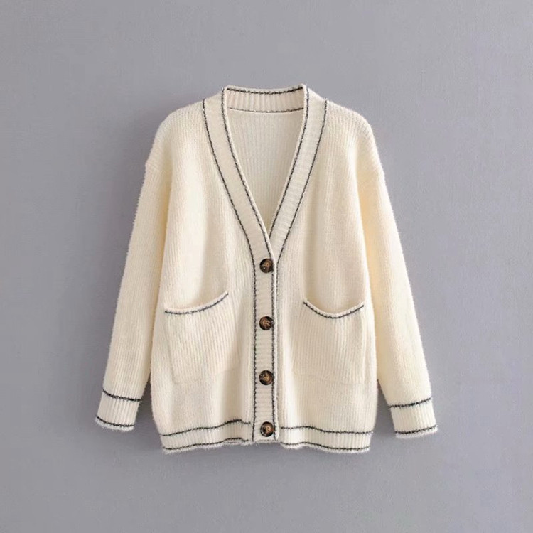 Női alkalmi mellény mély spitz nyakkivágással, fehér és fekete gombokkal