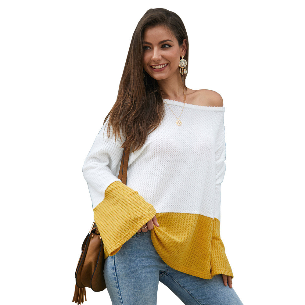 Ένα κομψό  γυναικείο πουλόβερ με φαρδιά μανίκια και ένα λαιμό O σε δύο χρώματα