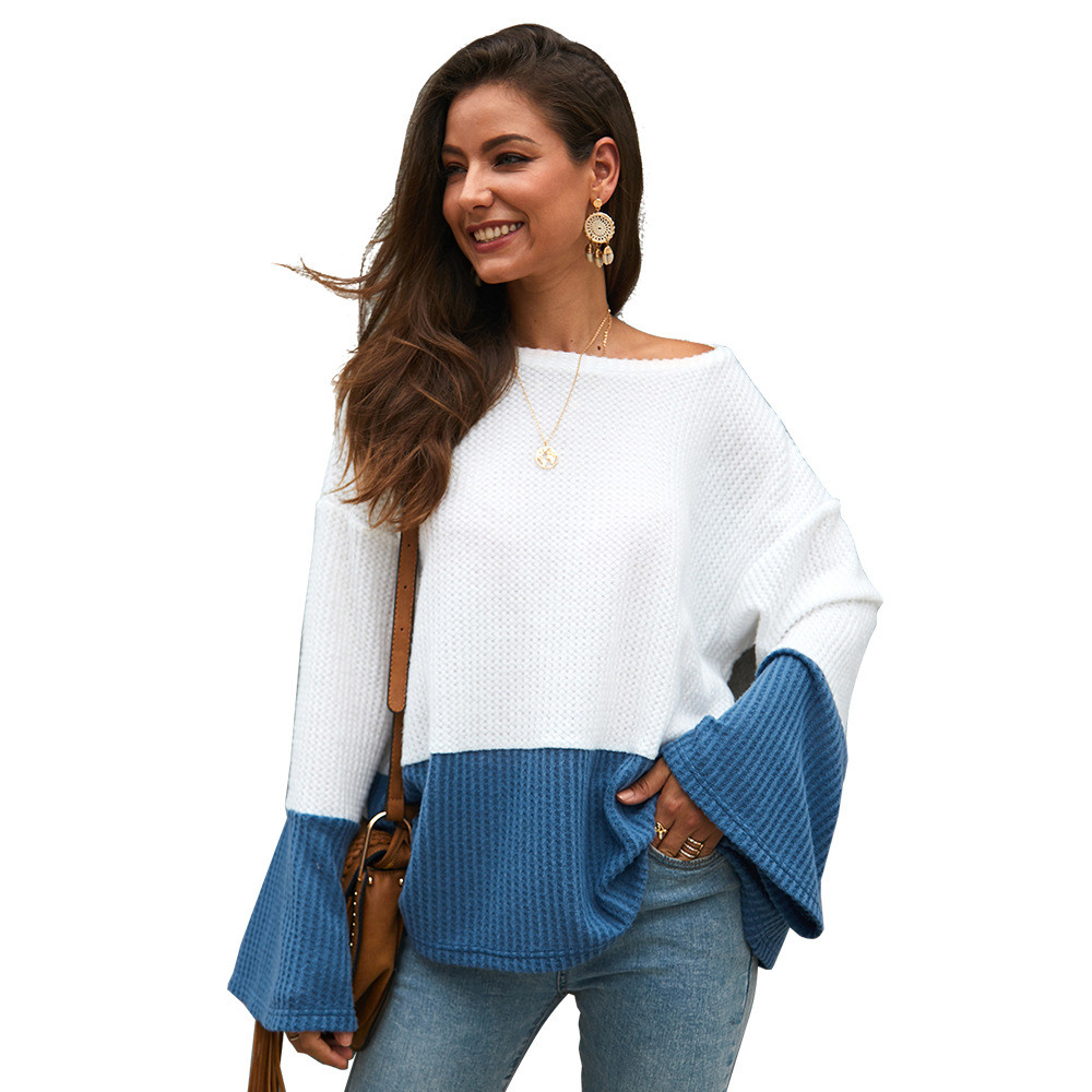 Ένα κομψό  γυναικείο πουλόβερ με φαρδιά μανίκια και ένα λαιμό O σε δύο χρώματα