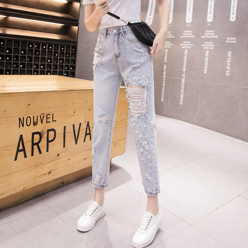Blugi de dama actuali cu motive rupte si perle decorative