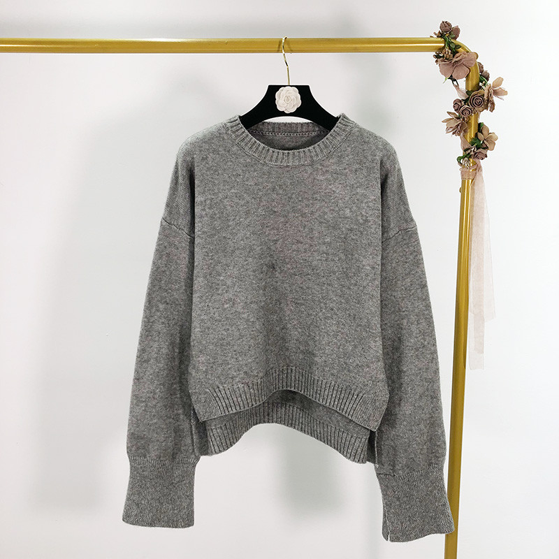 Ευρύ γυναικείο πουλόβερ  με πλαϊνές τσέπες σε τέσσερα χρώματα