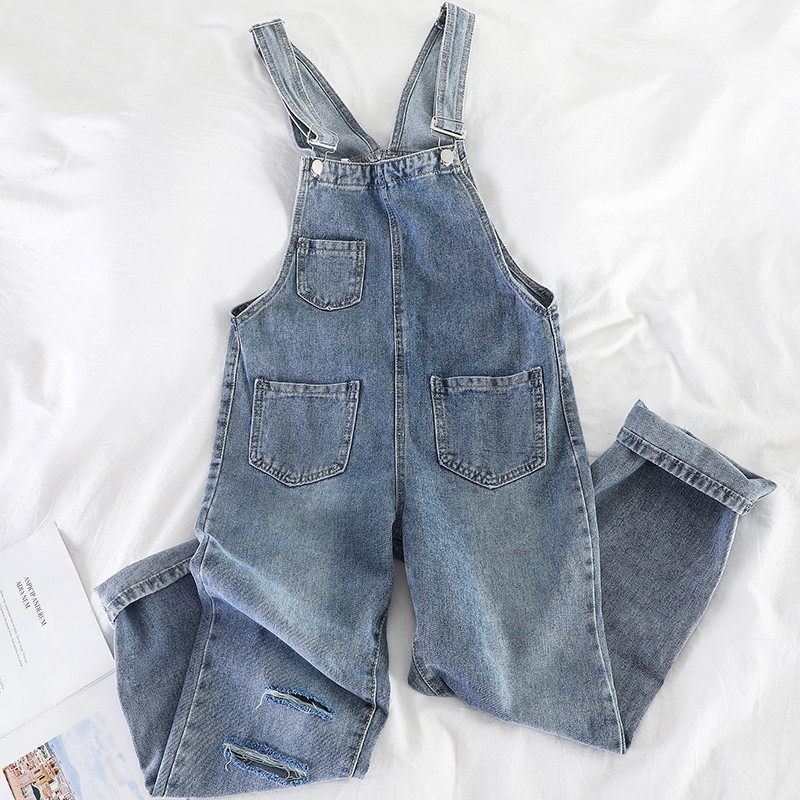 Salopetă de damă din denim cu motive rupte în negru și albastru