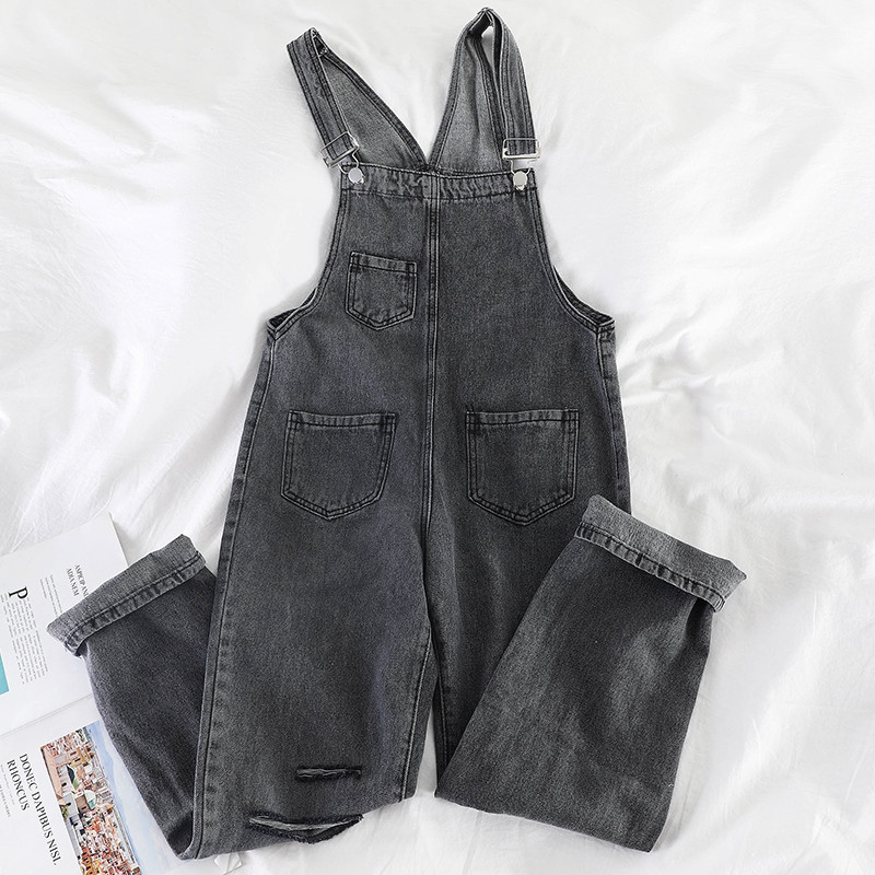 Salopetă de damă din denim cu motive rupte în negru și albastru