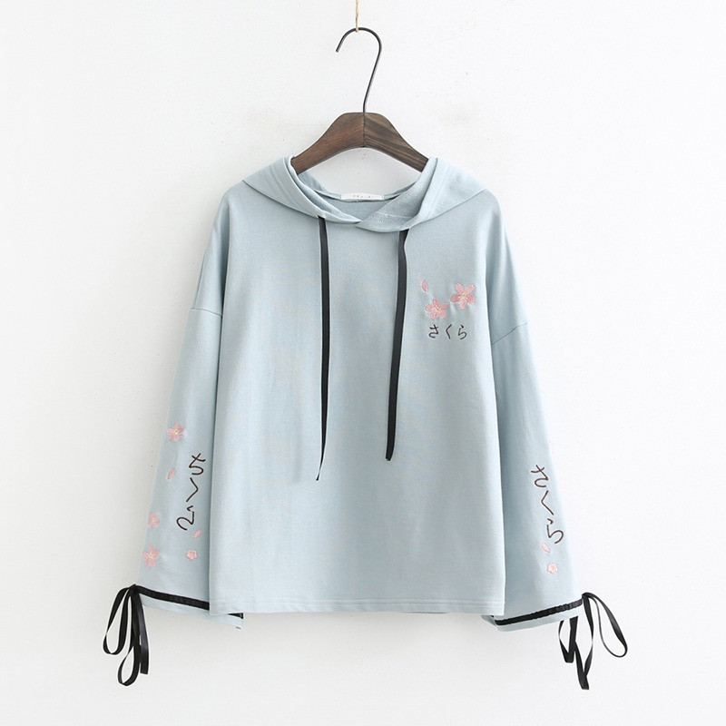 Új modell női blúz kapucnival, nyakkendővel és hímzéssel fehér és kék színben