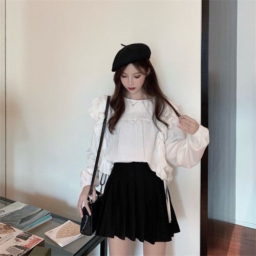 Bluză de damă cu mâneci lungi în alb și negru