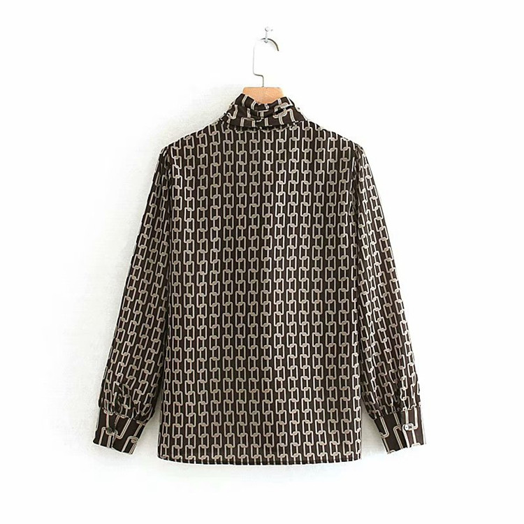 Elegáns női blúz szalaggal, mintás mintával