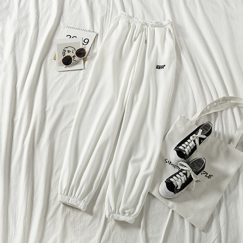 Női sport- és alkalmi nadrág fekete-fehér színben