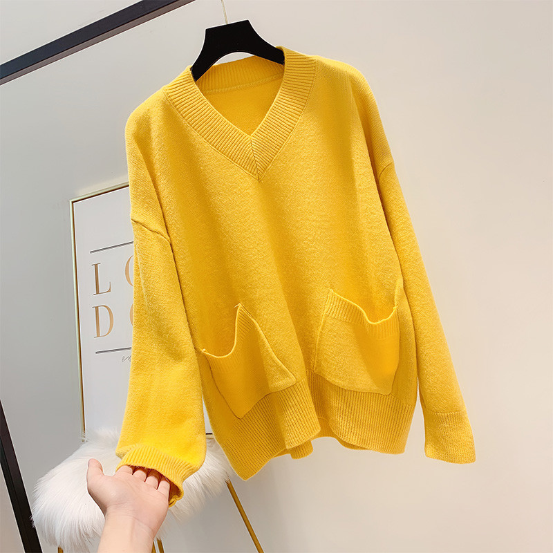 Női pulóver zsebbel és spitz nyakkivágással több színben