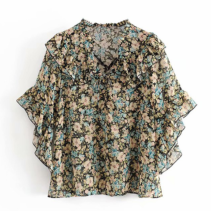 Bluză de damă elegantă cu model floral și decolteu în V