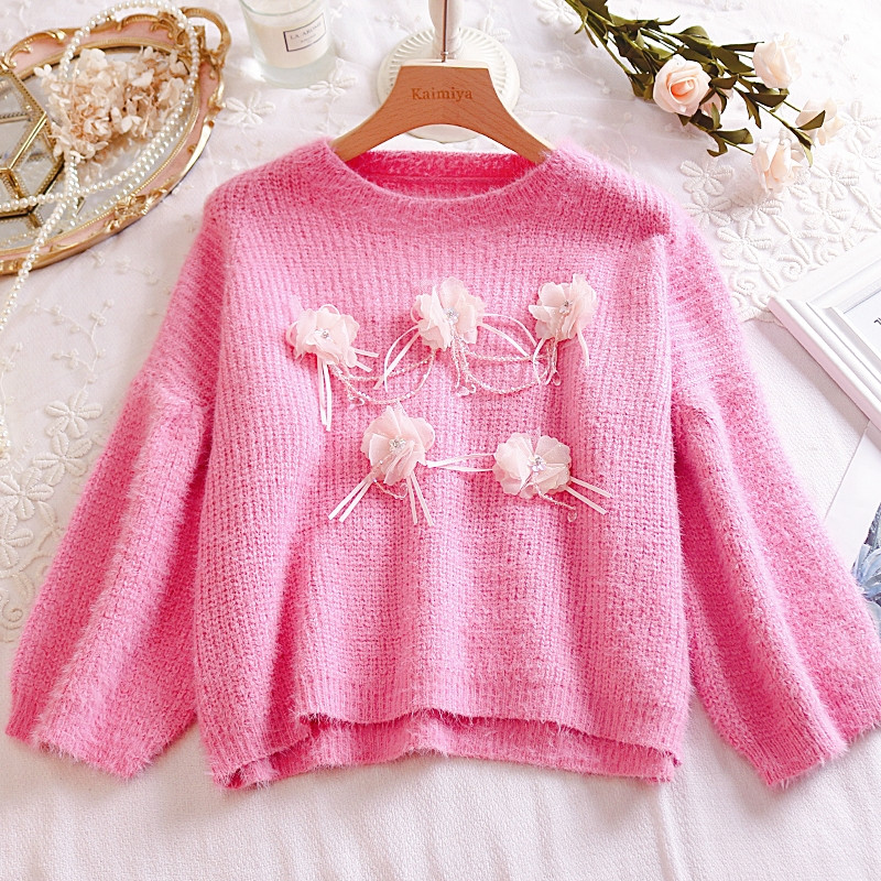 Γυναικείο πουλόβερ με τρισδιάστατο στοιχείο σε λευκό, κίτρινο και ροζ χρώμα