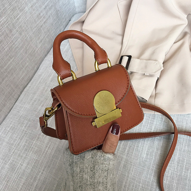 Geanta de dama mica cu inchidere metalica