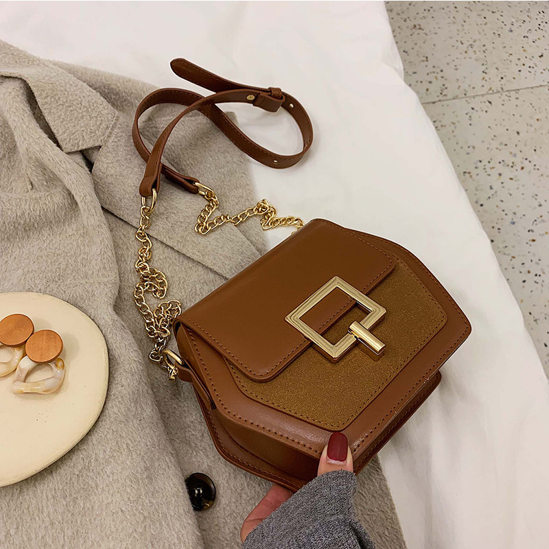 Női táska hosszú fém fogantyúval