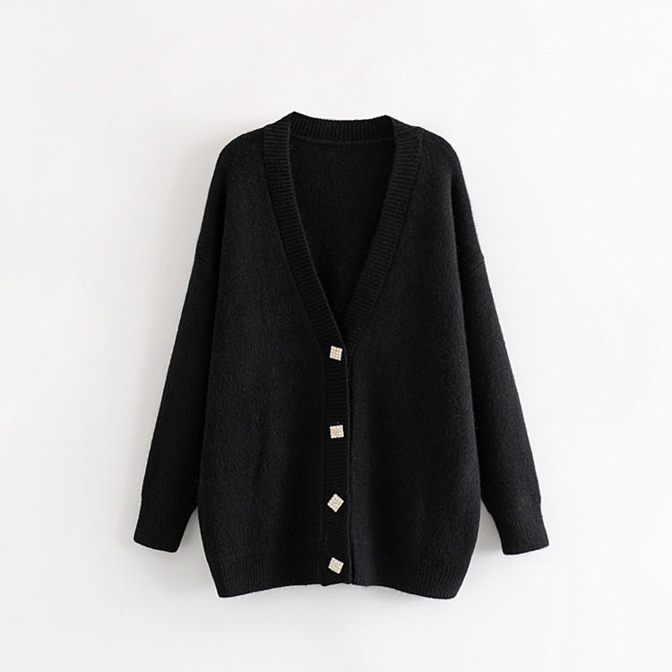 Κομψή γυναικεία ζακέτα σε λευκό και μαύρο χρώμα