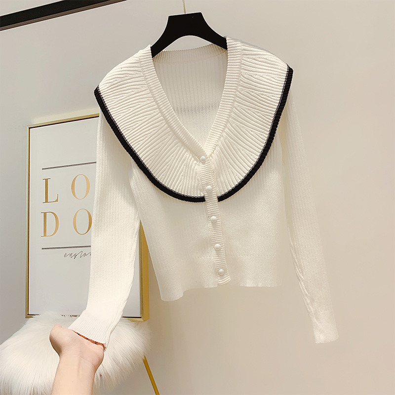 Női pulóver gombokkal és spitz nyakkivágással három színben