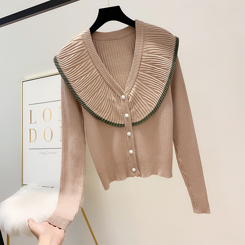 Női pulóver gombokkal és spitz nyakkivágással három színben