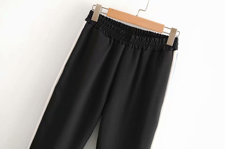 Női sportnadrág gumírozott derékkal és oldalsó szegéllyel